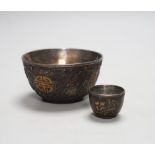 A cased part set of Chinese coconut cups, early 20th century white metal lined