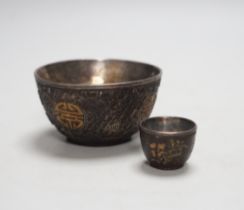 A cased part set of Chinese coconut cups, early 20th century white metal lined
