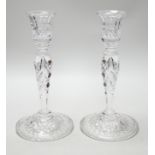 A pair of cut glass candlesticks, 25cm high