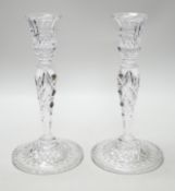 A pair of cut glass candlesticks, 25cm high
