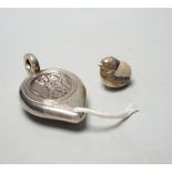 An Edwardian silver perpetual lighter, modelled as a lamp, embossed with figure, London, 1909, 91mm,