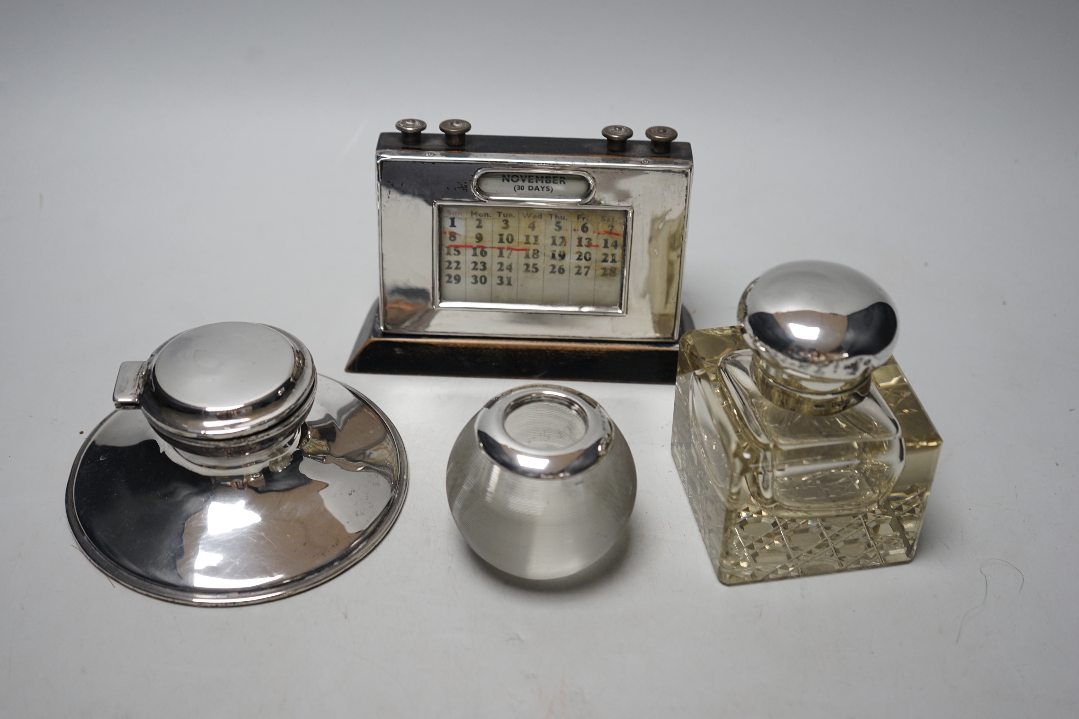 Two silver mounted inkwells, including capstan, a silver mounted desk calendar and a silver - Image 2 of 2