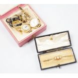 A small collection of gold jewellery and other items to include two 22ct. yellow gold wedding bands,