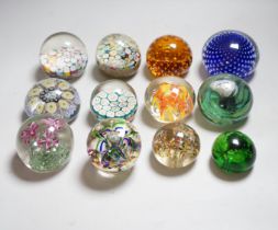 Twelve 20th century paperweights including Bohemian and Chinese examples, close packed millefleur