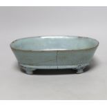 A Chinese celadon crackle glazed oval dish, 23cm wide