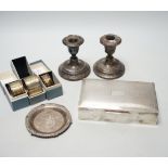A 1960's engine turned silver mounted rectangular cigarette box, three boxed silver napkin rings,