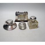 Two silver mounted inkwells, including capstan, a silver mounted desk calendar and a silver