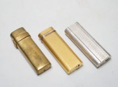 Two Cartier cigarette lighters and Christian Dior example
