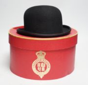 Two Bowler hats; a boxed example by Christys’ London and an unboxed hat by Pytchley with chin strap