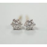 A pair of 750 and solitaire diamond set ear studs, gross weight 0.9 grams.