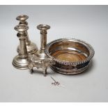 A pair of early 20th century silver mounted dwarf candlesticks, marks rubbed, height 13.2cm (a.