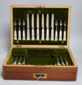 A mahogany case of plated cutlery and part set of mother of pearl handled fruit eaters, largest 46cm
