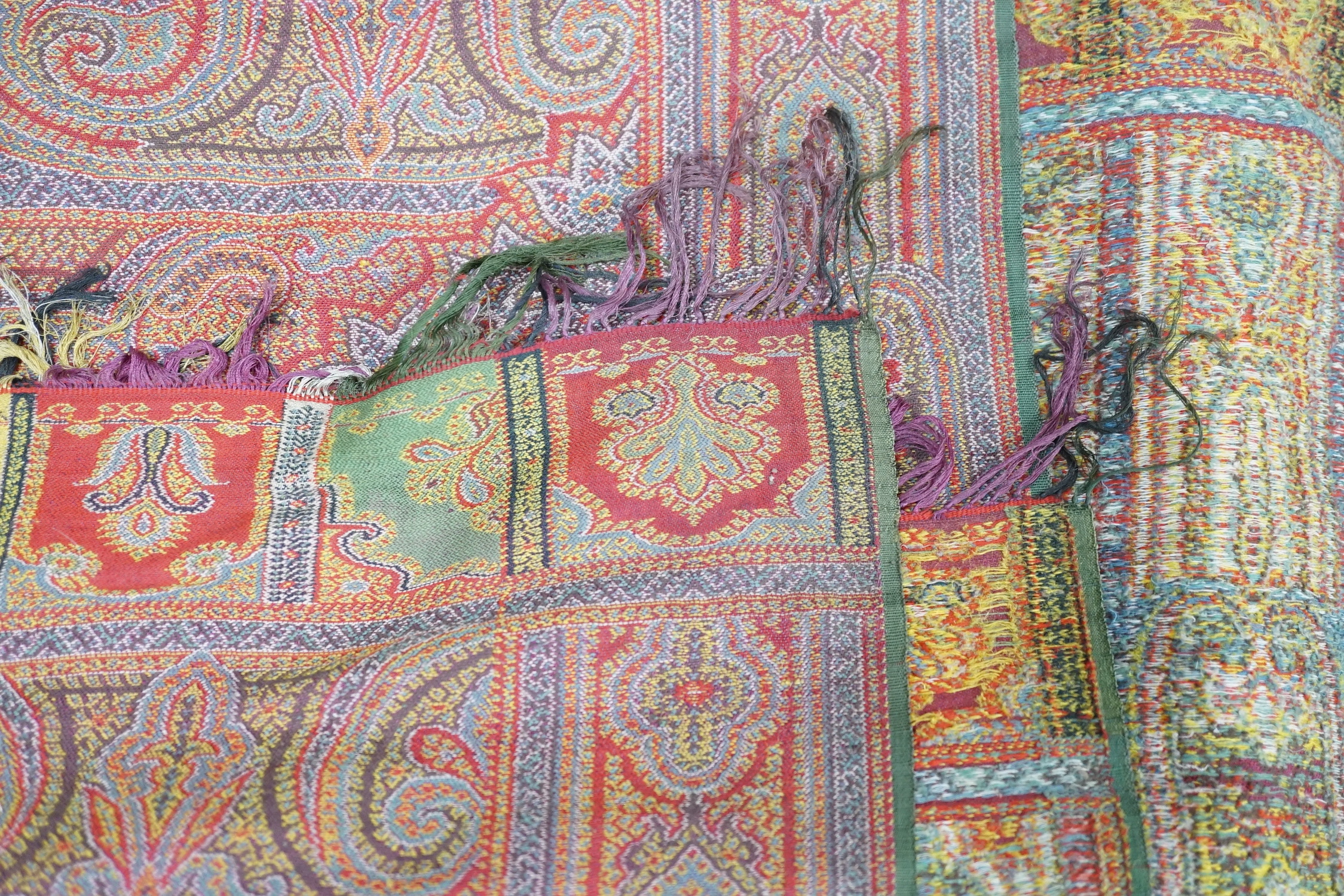 A 19th century woven multi coloured wool and silk Paisley shawl, with large all over paisley tear - Image 3 of 4