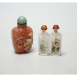Two Chinese snuff bottles with stoppers including a twin example, largest 7cm