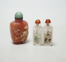 Two Chinese snuff bottles with stoppers including a twin example, largest 7cm