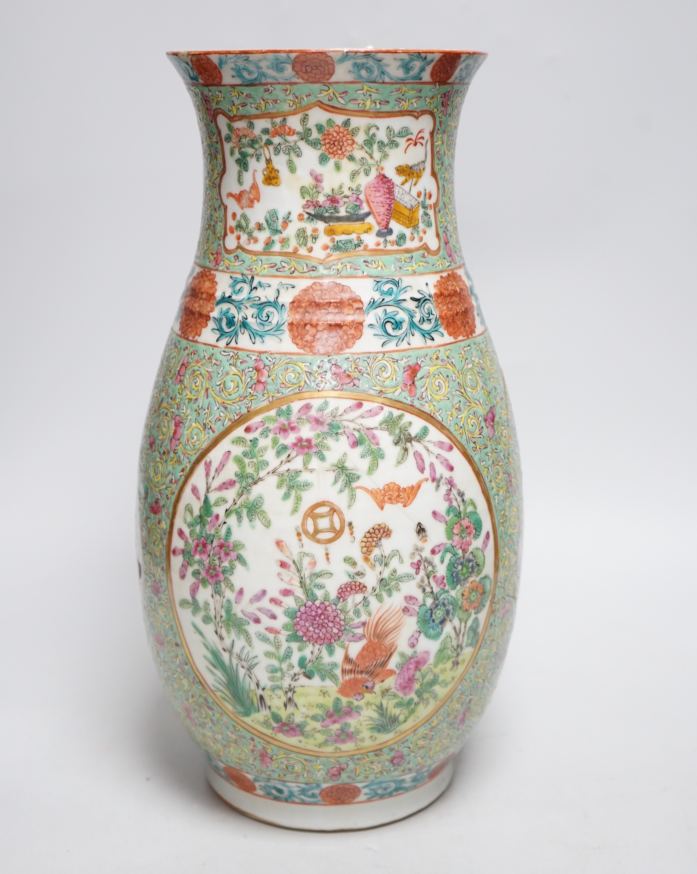 A 19th century Chinese enamelled porcelain vase on a green ground, 36.5cm