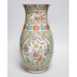 A 19th century Chinese enamelled porcelain vase on a green ground, 36.5cm