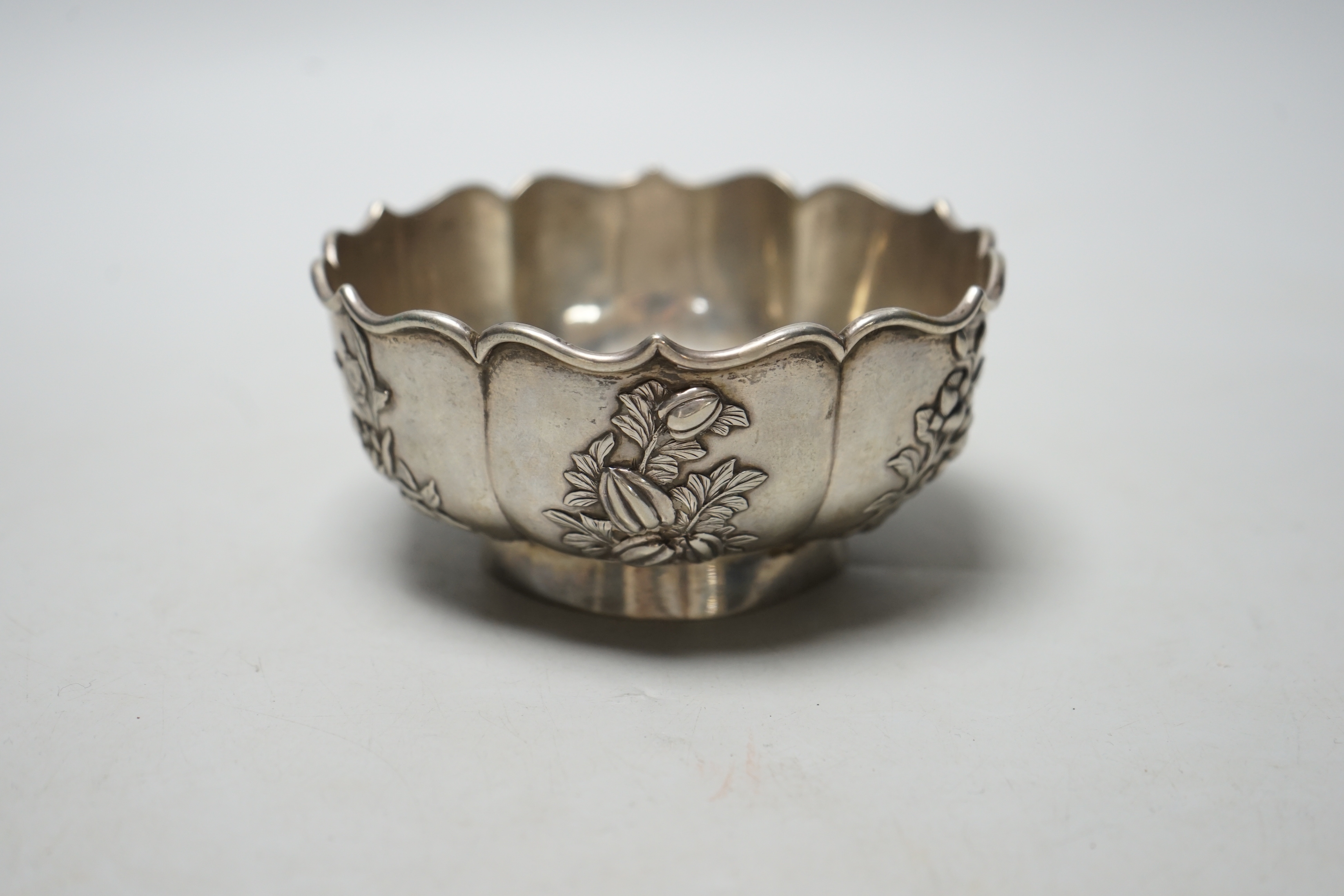 A late 19th/early 20th century Chinese white metal bowl, by Zee Wo, with applied flowers, diameter