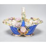 A Rockingham type floral encrusted china basket, 32cm