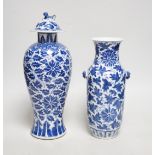 A late 19th century Chinese blue and white 'Lotus' vase and cover and another similar (2), tallest