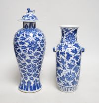 A late 19th century Chinese blue and white 'Lotus' vase and cover and another similar (2), tallest