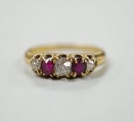 A yellow metal, two stone ruby and three stone diamond set half hoop ring, size J, gross weight 2.
