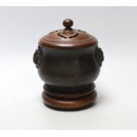 A Chinese bronze censer with carved and pierced wooden lid and stand, 14.5cm