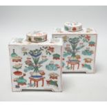 A pair of Chinese famille verte square form caddies and covers, 16cm