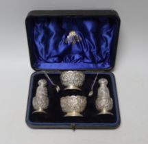 A cased late Victorian Anglo Indian style four piece silver condiment set with two matching