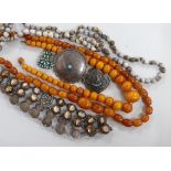 Two graduated amber amber bead necklaces, 100cm and 41cm, gross weight 116 grams, together with