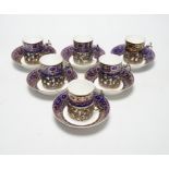 A set of six silver jacketed porcelain cups and saucers