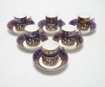 A set of six silver jacketed porcelain cups and saucers