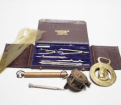 A mixed group of collectables including a commemorative bottle opener, shooting medallion, fishing