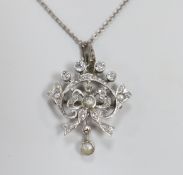 An early 20th century white metal, millegrain set diamond and split pearl cluster set drop pendant/