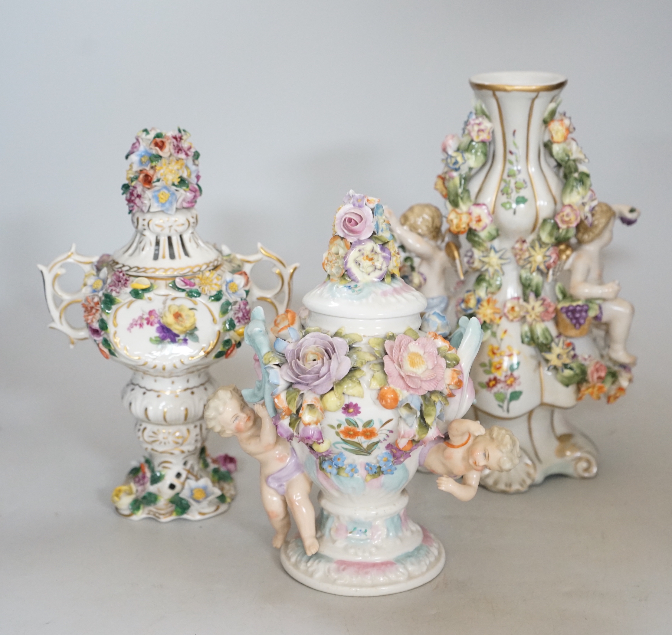 A quantity of German floral encrusted porcelain