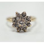 A modern 9ct gold and diamond cluster ring, size K/L, gross weight 3.1 grams.