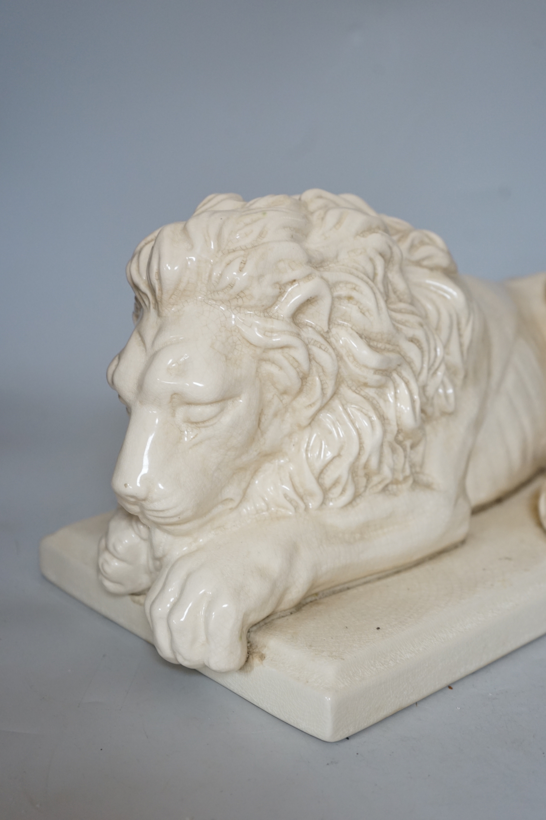 After Canova, a French cream crackleware pottery recumbent lion, 46cm wide - Image 2 of 3