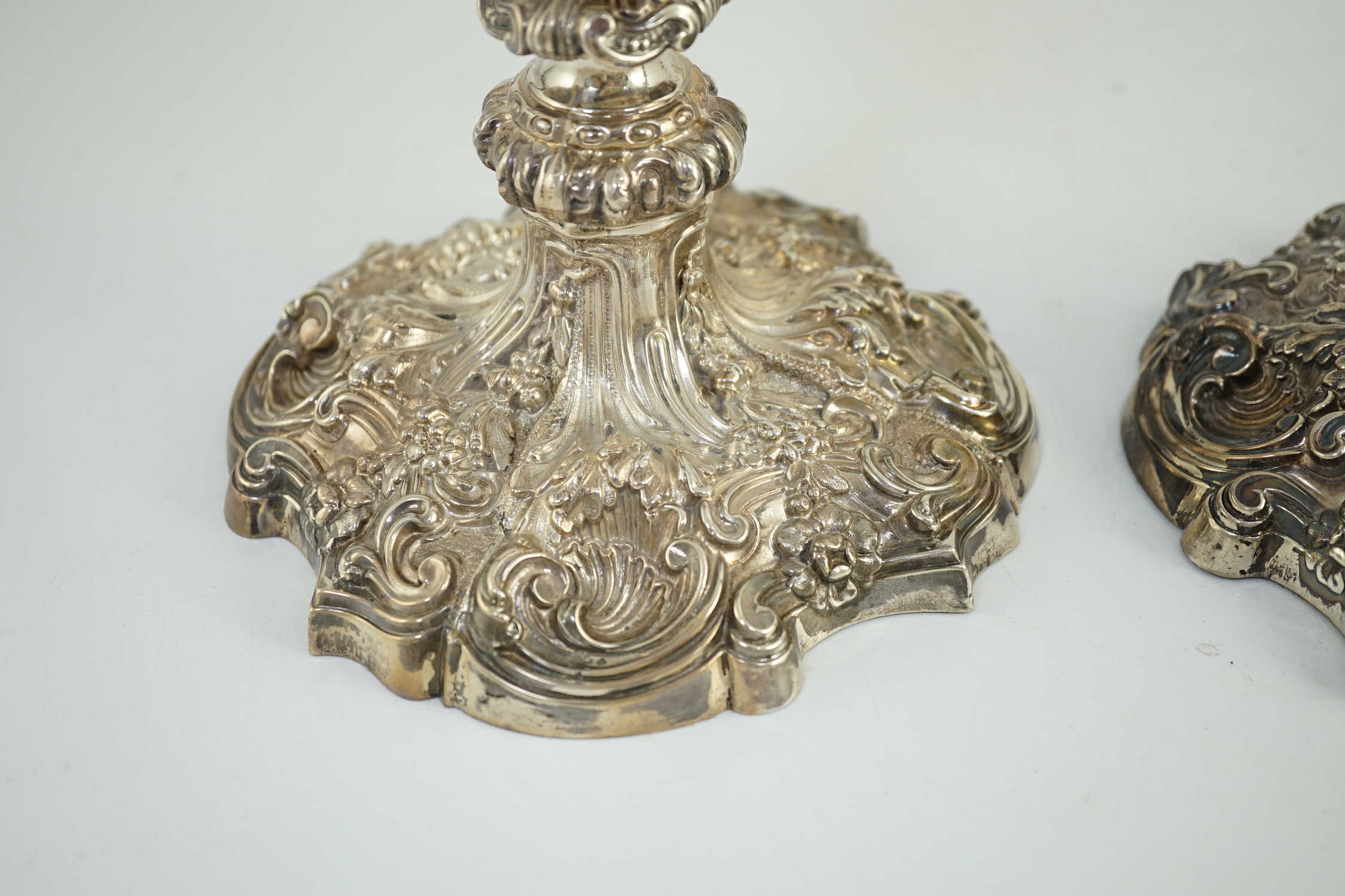 An ornate pair of Edwardian silver candlesticks, by Walker & Hall, with fixed sconces, waisted - Image 9 of 11
