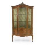 A French Louis XVI style marquetry inlaid vitrine with ormolu mounts, single central door