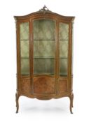 A French Louis XVI style marquetry inlaid vitrine with ormolu mounts, single central door