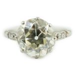 A mid 20th century platinum and single stone diamond ring, with six stone diamond chip set