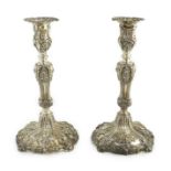 An ornate pair of early Victorian silver candlesticks by Creswick & Co, with waisted stems and