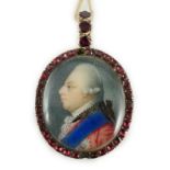 A George III Royal Presentation gold mounted and garnet set oval pendant, with inset miniature