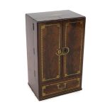 A Regency brass inset mahogany apothecary chest with two doors, enclosing a compartmented interior