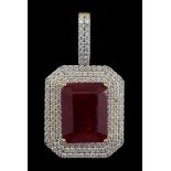 A large modern 18ct gold and single emerald cut synthetic ruby set pendant, bordered by three c