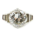 An Art Deco platinum and single stone diamond set ring, with six stone graduated baguette cut