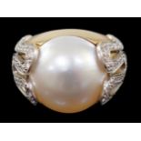 A modern Italian Versace 18ct gold and half cultured pearl set dress ring, with round brilliant
