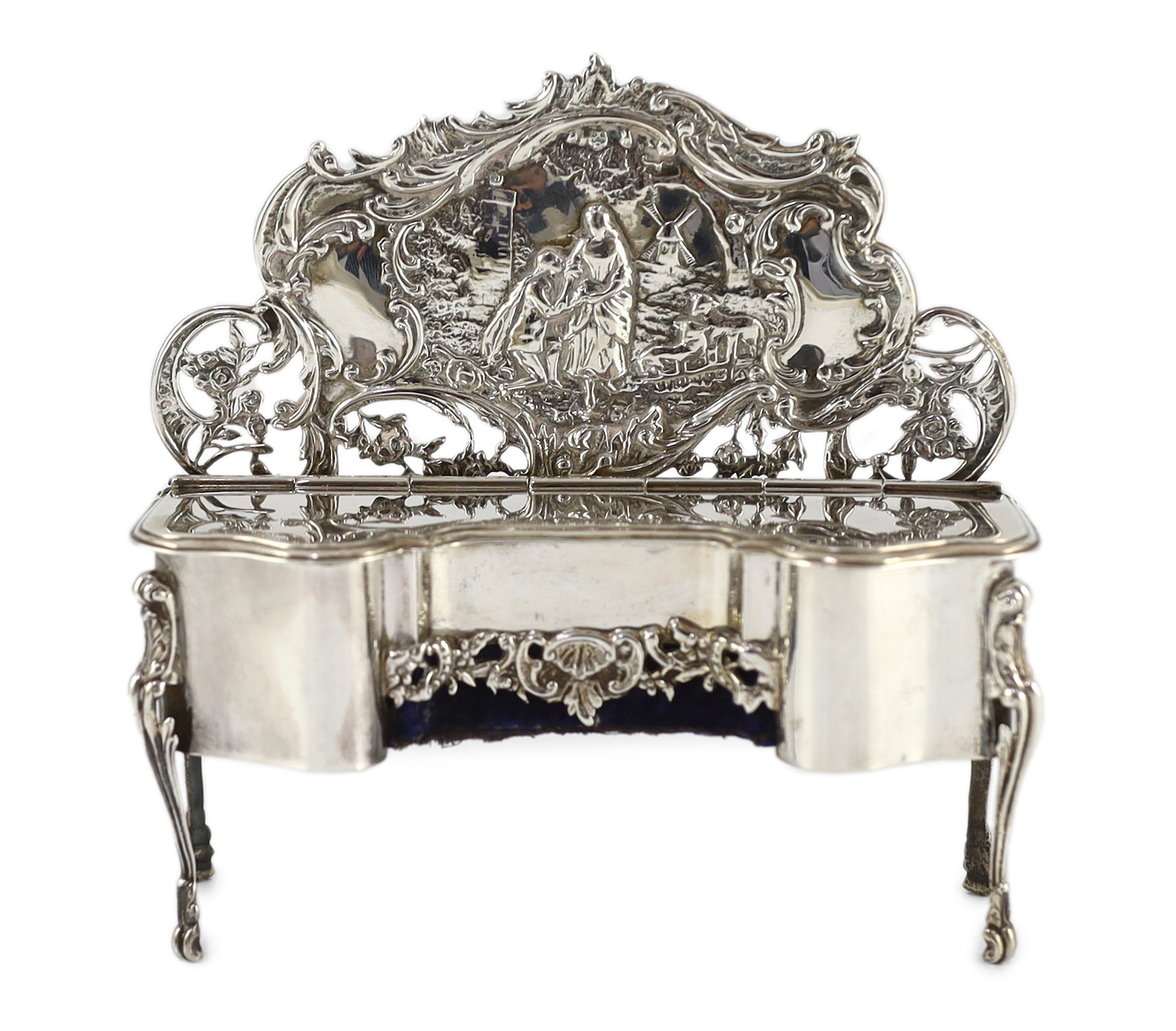 An Edwardian embossed silver novelty trinket box, modelled as a dressing table with raised back,