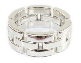 A modern Cartier 18ct white gold segmental band, signed and numbered IN 3864, size I, 14.7 grams,