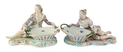 A pair of large Meissen figural bonbon dishes, 19th century, modelled as a lady and gentlemen in